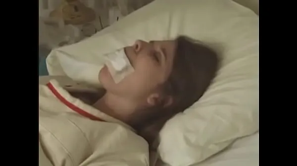 새로운 Pretty brunette in Straitjacket taped mouth tied to bed hospital 에너지 동영상
